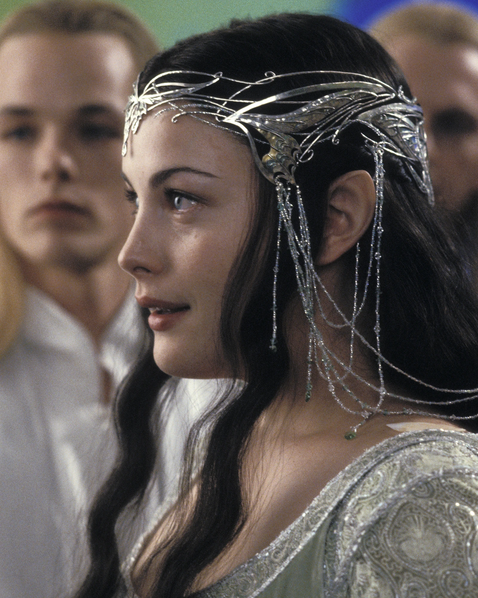 An intricate silver-coloured crown with branching details and delicate hanging chains.
